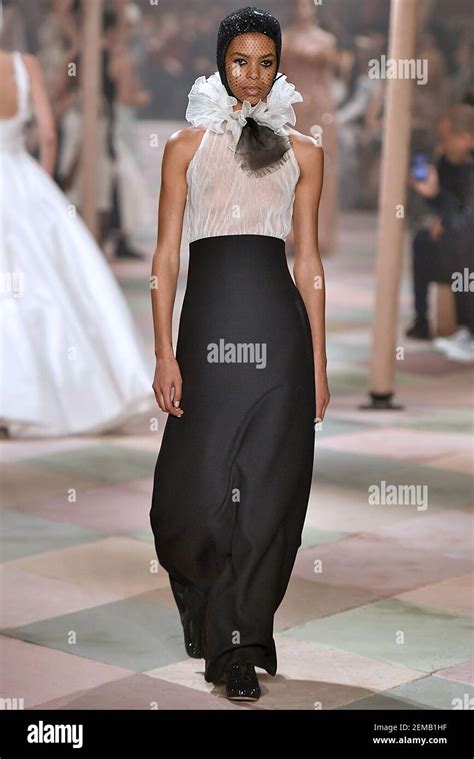 Alyssa Traore walks the runway during the Dior Haute Couture